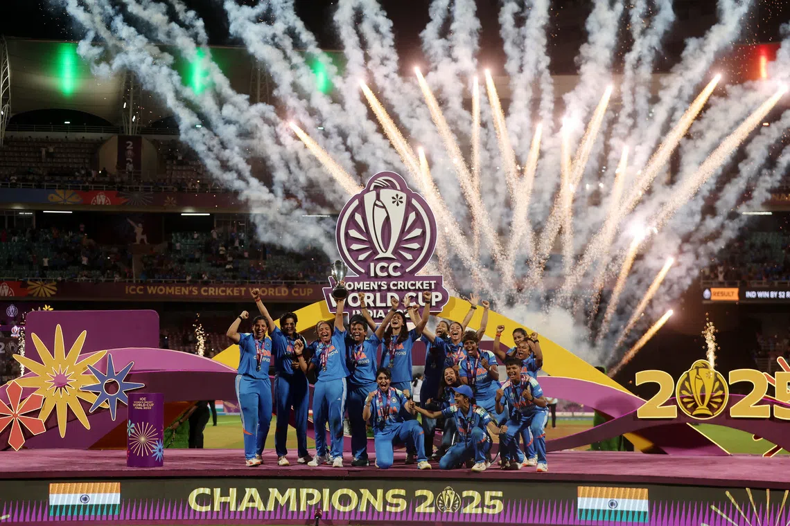 Cricket - ICC Women's World Cup - Final - India v South Africa - DY Patil Stadium, Navi Mumbai, India - November 2, 2025 India players celebrate with the trophy after winning the ICC Women's World Cup REUTERS/Francis Mascarenhas