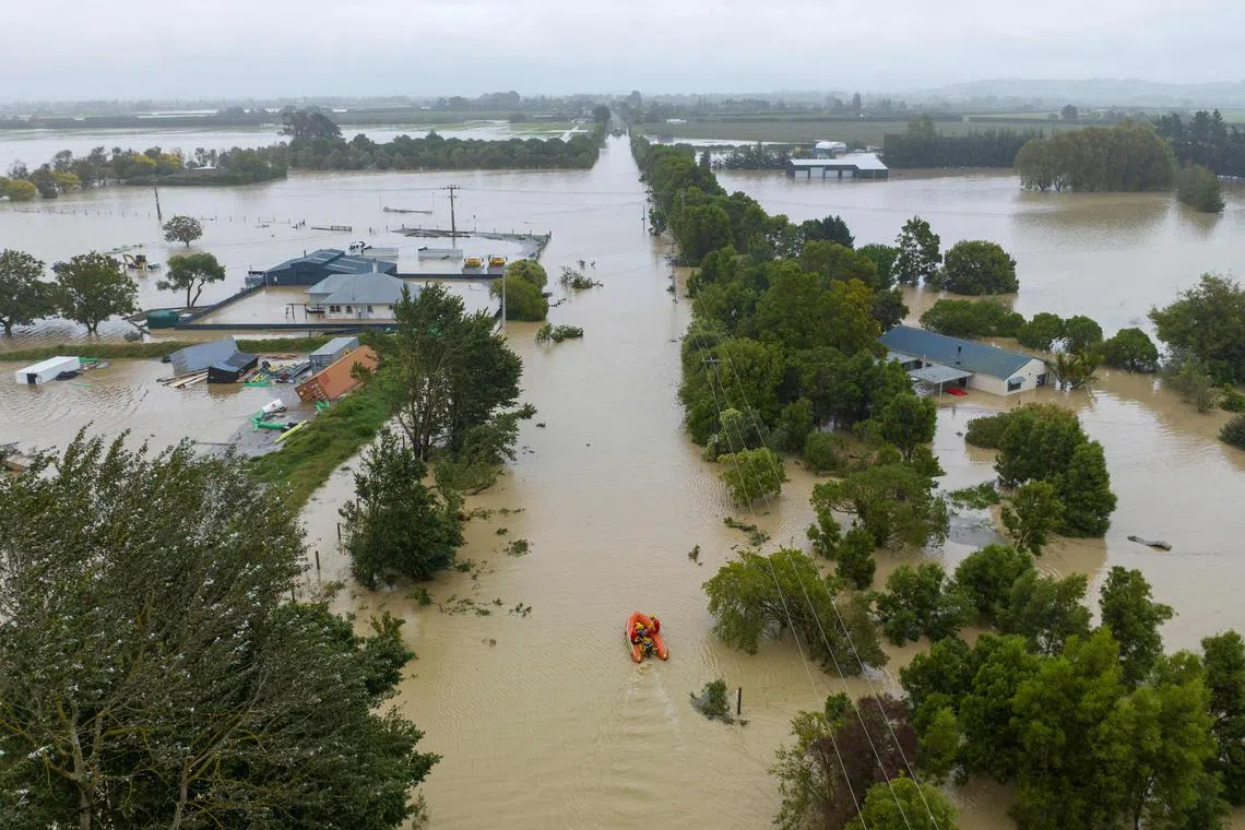 An aerial photo shows flooding caused by Cyclone Gabrielle in Awatoto, near the city of Napier, New Zealand, Feb 14, 2023.