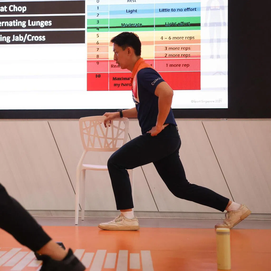 anhyper ST20250917_202596000285 Ong Wee Jin / Akshita Nanda / 

Mr Christopher Huang (right), an Active Health Coach with Sport Singapore, conducting a Manage Hypertension With Exercise session, run by ActiveSG, at Heartbeat@Bedok, Sept 17, 2025.