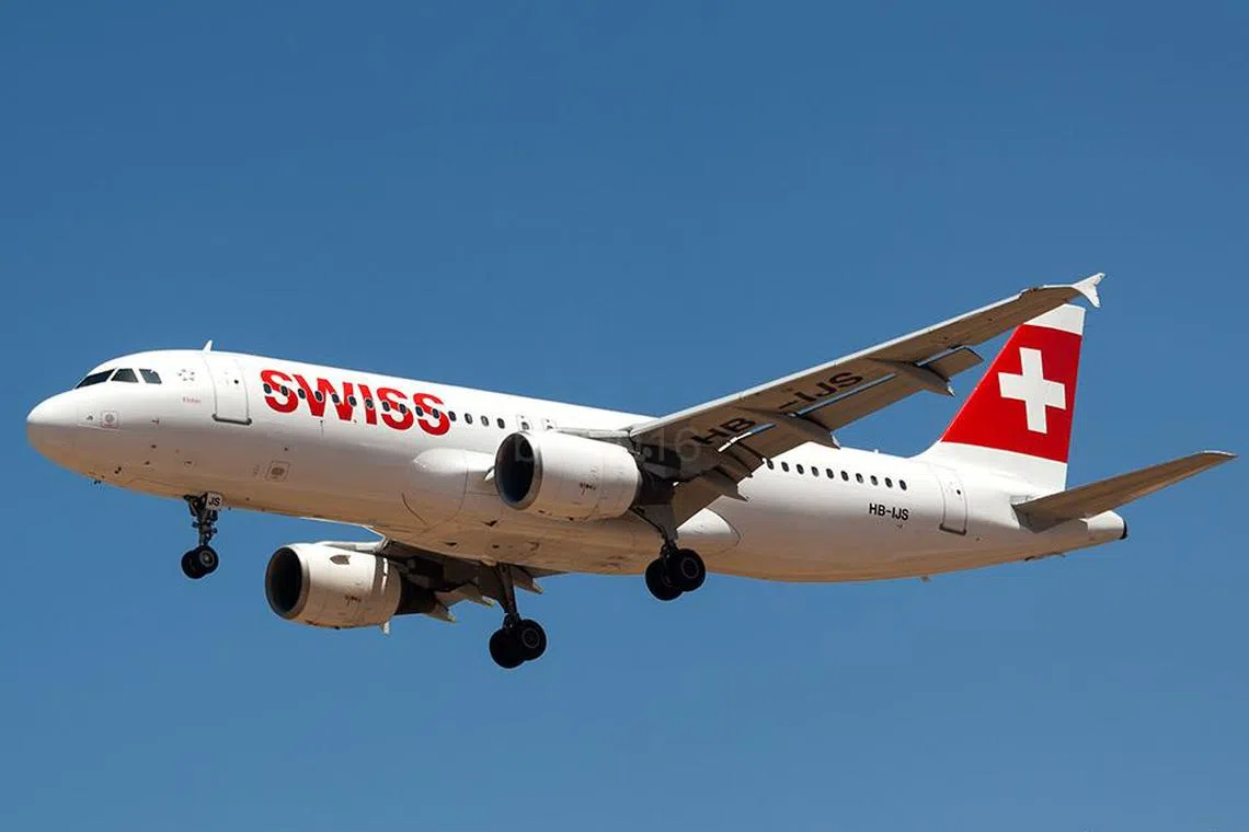 Swiss International Air Lines said the plane's nose wheel became caught in the grass on landing and was stuck, requiring the jet to be towed back onto the runway.