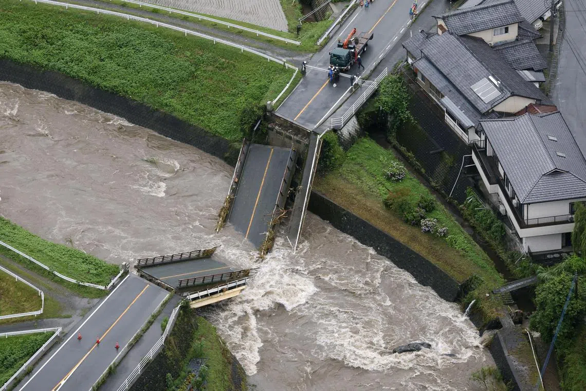 An aerial view shows a bridge over the Mifune River which collapsed due to heavy rain is seen in Yamato town, Kumamoto prefecture, southwestern Japan, July 3, 2023, in this photo taken by Kyodo. Mandatory credit Kyodo via REUTERS ATTENTION EDITORS - THIS IMAGE WAS PROVIDED BY A THIRD PARTY. MANDATORY CREDIT. JAPAN OUT. NO COMMERCIAL OR EDITORIAL SALES IN JAPAN