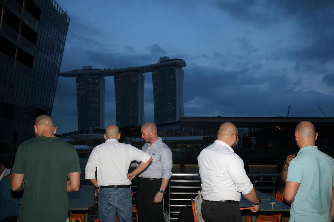 The alfresco space at Marina Bay buzzes with lively conversations as the night progresses.