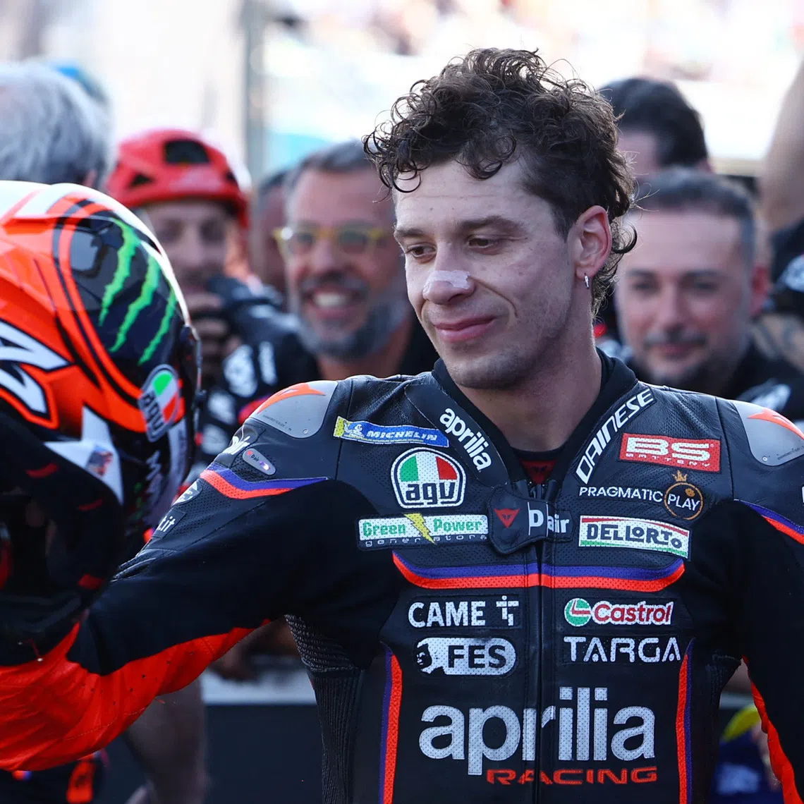 FILE PHOTO: MotoGP - Hungarian Grand Prix - Balaton Park Circuit, Balatonfokajart, Hungary - August 24, 2025 Aprilia Racing's Marco Bezzecchi celebrates finishing third in the MotoGP race REUTERS/Bernadett Szabo/File Photo