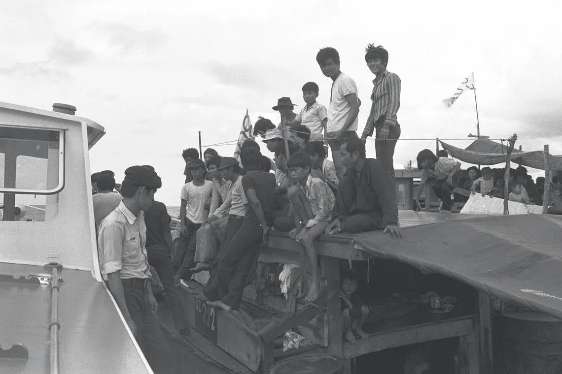Vietnamese refugees (boat people) arrived in Singapore by boat, 8 June 1975.