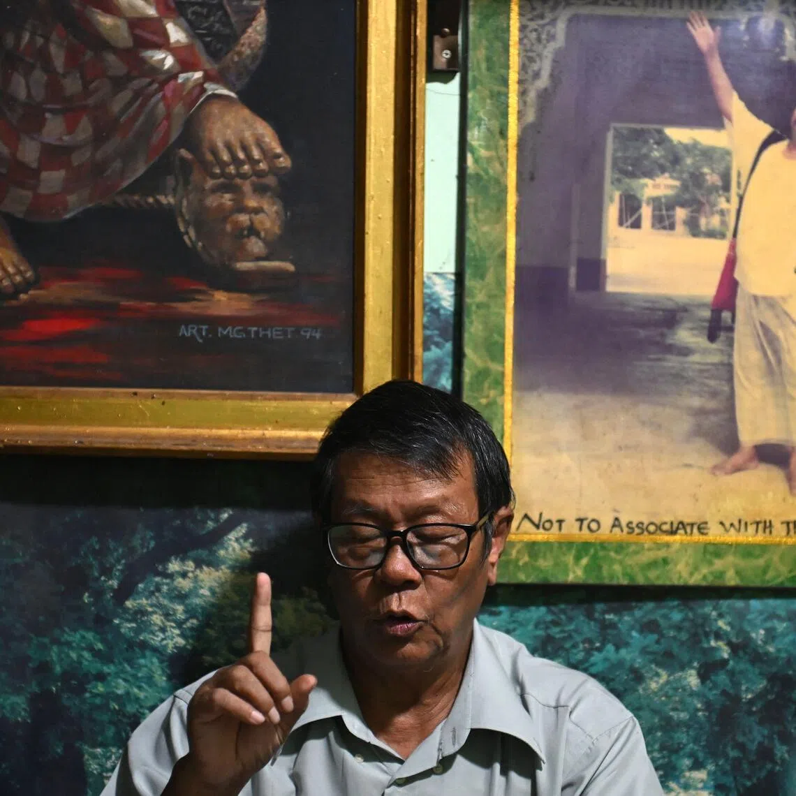 Astrologer Min Thein Kyaw consulting with a client at his fortune-telling studio in Yangon on Dec 17, 2025.
