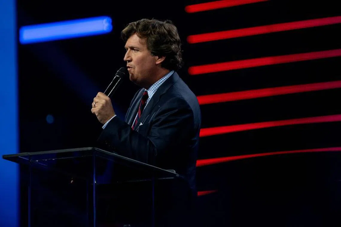 FILE PHOTO: Tucker Carlson speaks as conservative leaders and personalities attend Turning Point USA's AmericaFest 2023 in Phoenix, Arizona, U.S. December 18, 2023.  REUTERS/Caitlin O’Hara