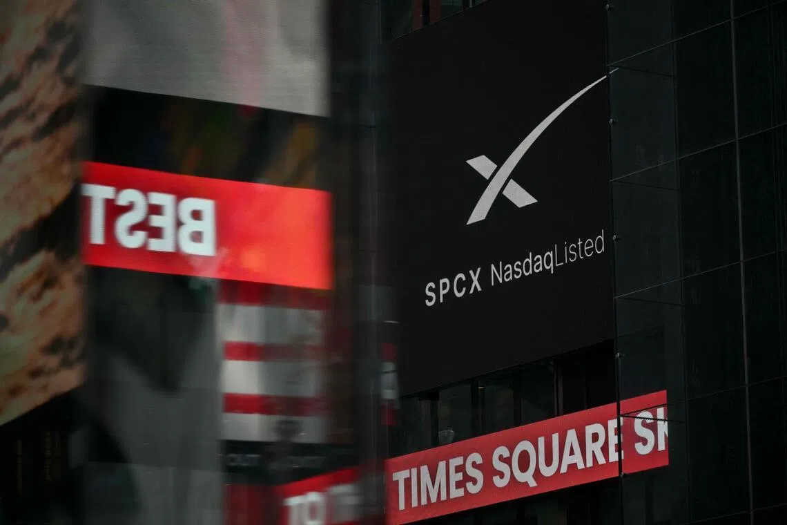 An advertisement for SpaceX is displayed on a screen at Times Square after the launch of SpaceX’s initial public offering (IPO) in New York on June 12, 2026. Shares in Elon Musk's SpaceX jumped as much as 30 per cent on their trading debut after the biggest IPO in history, making the polarising entrepreneur the world's first trillionaire as he vowed to take humanity to Mars. (Photo by ANGELA WEISS / AFP)