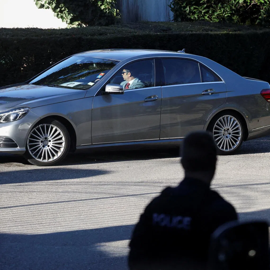 A diplomatic car carrying Iranian delegation drives near the residence of the Omani ambassador to the United Nations, believed to be the venue for indirect U.S.-Iran talks over their long-running nuclear dispute, in Cologny, Switzerland, February 26, 2026. REUTERS/Florion Goga