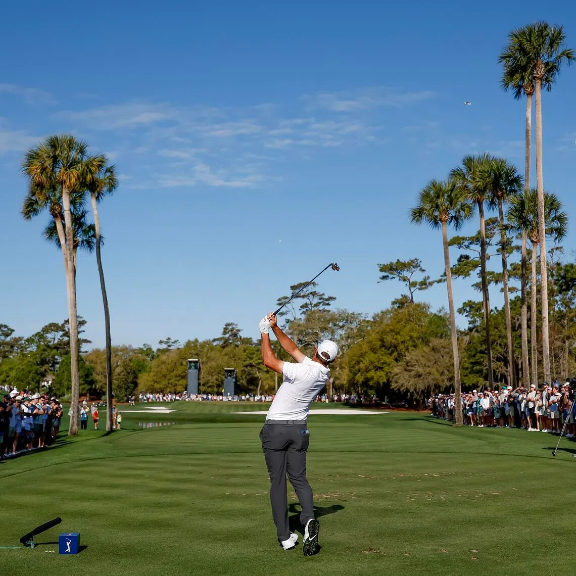 Scottie Scheffler of the US tees the third hole during the third round of The Players Championship, on March 14.