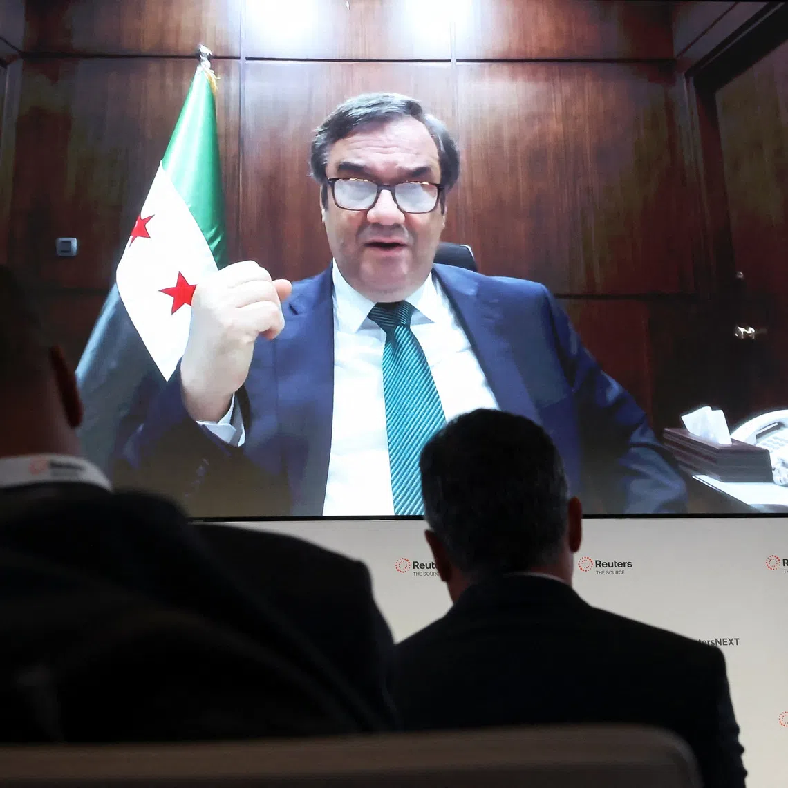 Abdul Kader AlHussrieh, Governor, Central Bank of Syria speaks via video link during the Reuters NEXT conference in New York City, U.S., December 4, 2025.  REUTERS/Brendan McDermid