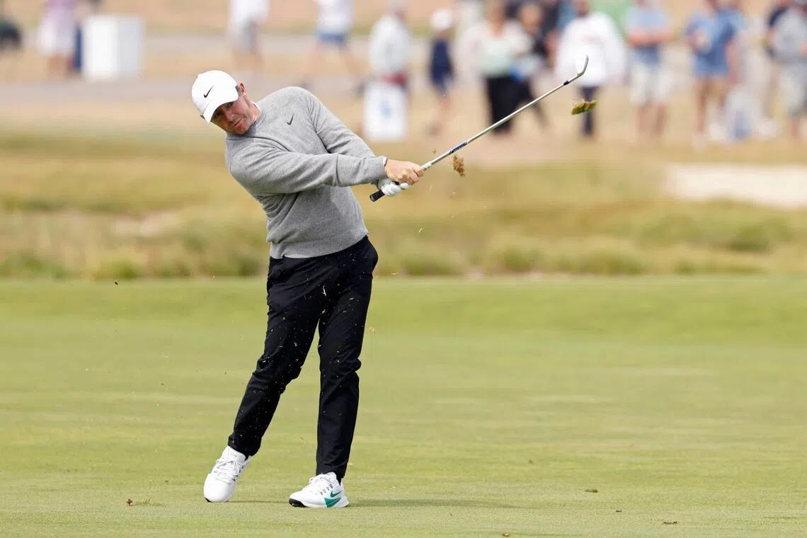Rory McIlroy of Northern Ireland plays a shot on the eighth hole during the first round of the 126th US Open.
