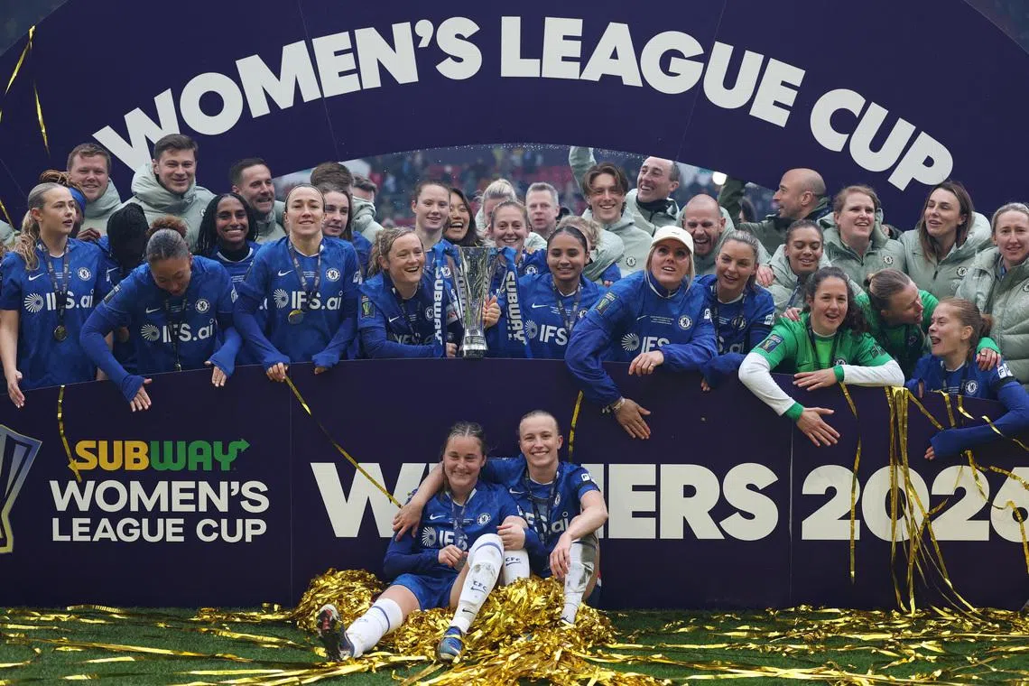 Soccer Football - Women's League Cup - Final - Chelsea v Manchester United - Ashton Gate Stadium, Bristol, Britain - March 15, 2026 Chelsea's Erin Cuthbert holds the trophy with teammates after winning the Women's League Cup final Action Images via Reuters/John Sibley