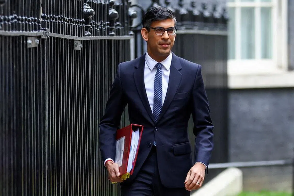 FILE PHOTO: British Prime Minister Rishi Sunak walks at Downing Street in London, Britain March 15, 2023. REUTERS/Hannah McKay/File Photo