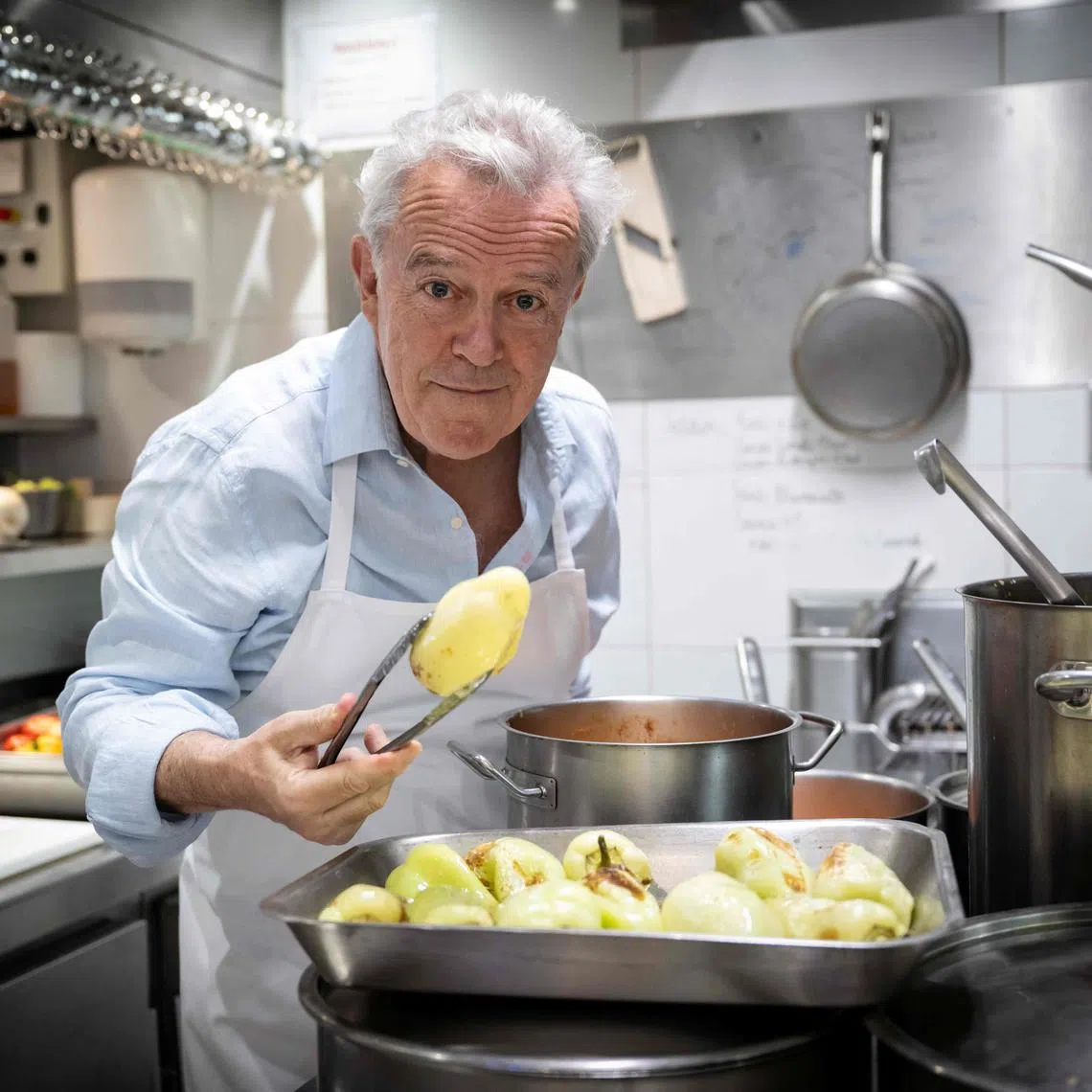 French chef Alain Passard poses in his restaurant 'L'Arpege' in Paris during a photo session on July 22, 2025. Incomparable "gustatory emotions": for the first time in a three-star restaurant in France, Alain Passard is now serving exclusively plant-based cuisine, a sign of a still discreet but real turning point in haute gastronomy. (Photo by BERTRAND GUAY / AFP)