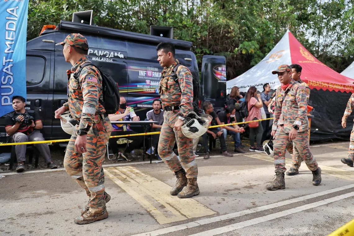 Rescuers work in shifts to search for the victims at the disaster site. 