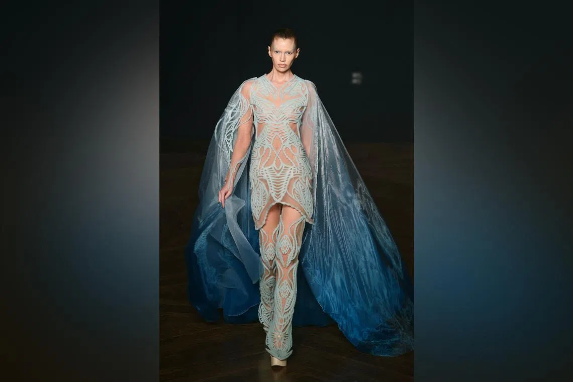 Belgian model Stella Maxwell presents the algae dress for Iris van Herpen during the Women's Haute-Couture Fall/Winter 2025-26 collection show in Paris on July 7.