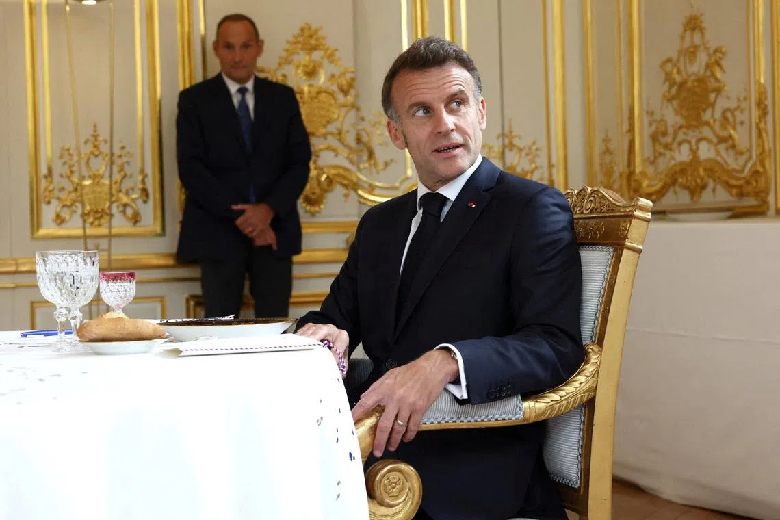 French President Emmanuel Macron poses before a working lunch of bilateral talks with British Prime Minister Keir Starmer ahead of the multinational virtual summit at the Elysee Presidential Palace, in Paris, France, on April 17, 2026. Tom Nicholson/Pool via REUTERS