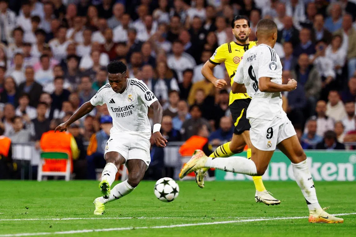 Real Madrid's Vinicius Junior scoring their fourth goal in the 5-2 win over Borussia Dortmund.