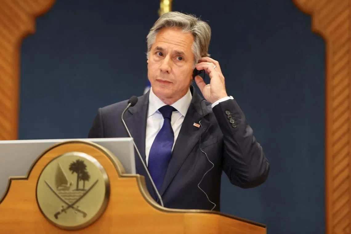 U.S. Secretary of State Antony Blinken adjusts his earpiece at a joint press conference with the Qatari prime minister in Doha, Qatar, June 12, 2024. REUTERS/Ibraheem Al Omari/Pool
