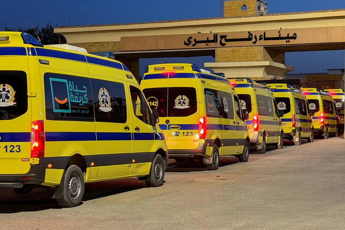 Egyptian ambulances line up to the Gaza Strip through the Rafah border from the Egyptian side, following the first day Israel reopened the border between Gaza and Egypt on Monday for people on foot, in Rafah, Egypt, February 2, 2026. REUTERS/Stringer