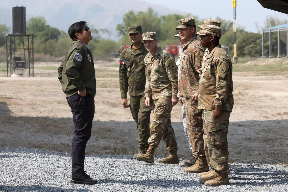 Philippine President Ferdinand Marcos Jr (left) with US and Philippine military officers during a briefing for Exercise Balikatan on April 26.