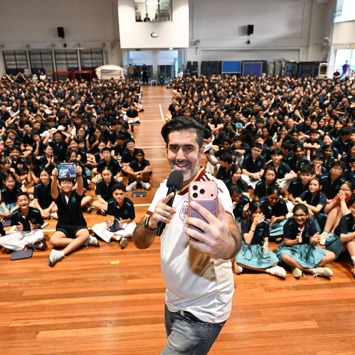 Students from Swiss Cottage Secondary School participating in the What’s the News? assembly programme, hosted by local comedian Rishi Budhrani, on July 9.