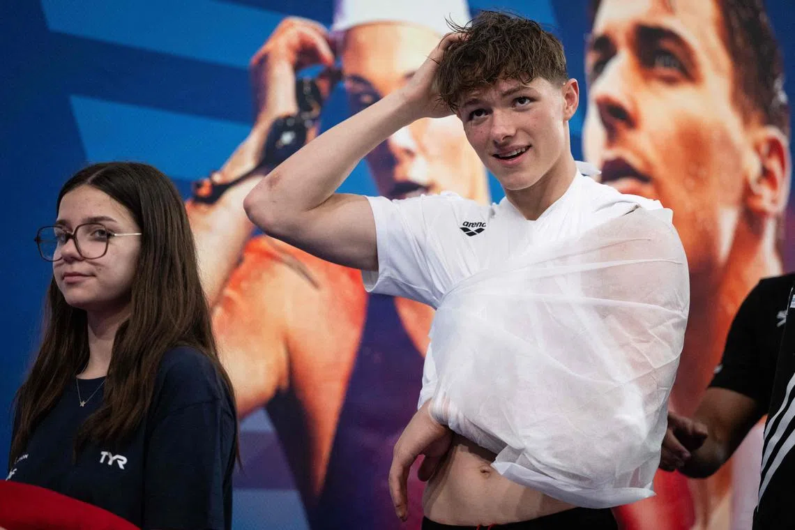 Injured Rafael Fente Damers awaiting the podium ceremony for the 100m freestyle in which he finished second at the French swimming championships in Chartres, on June 18, 2024.