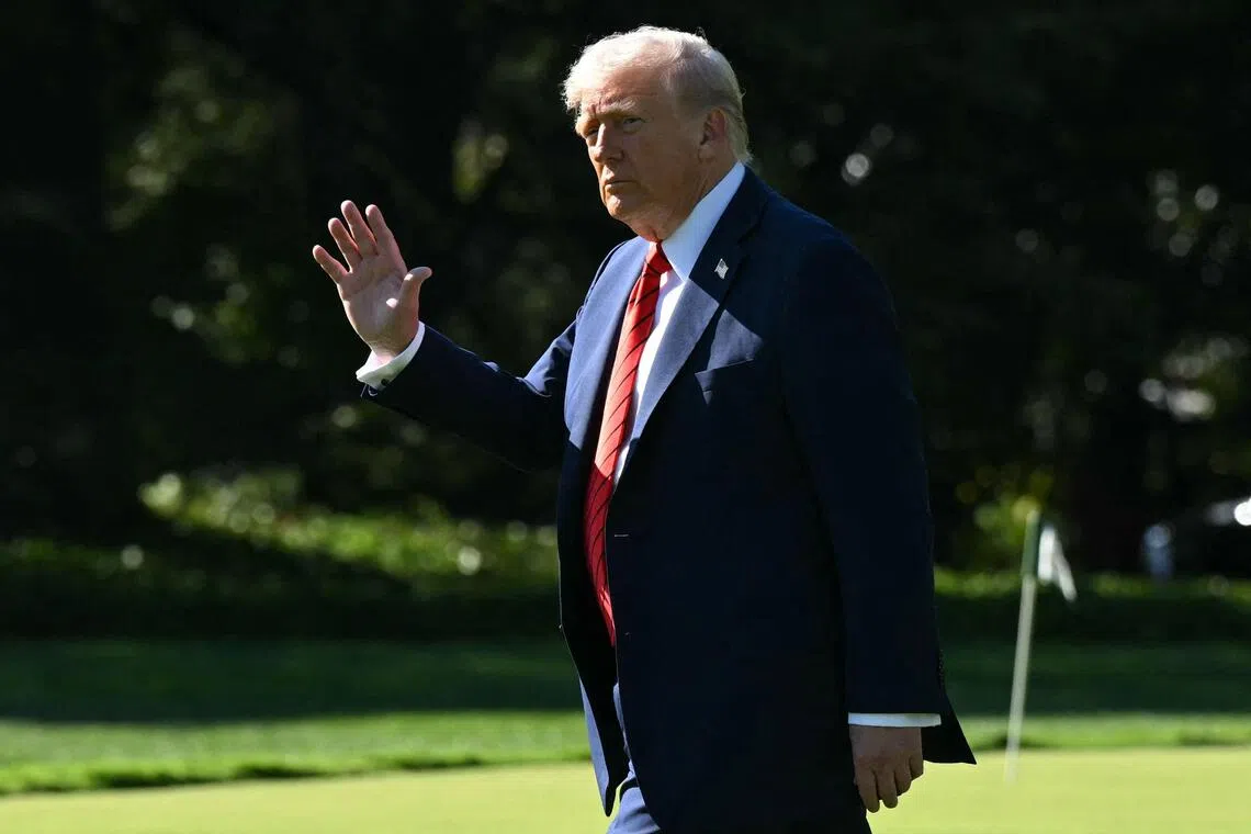 US President Donald Trump waves as he walks to Marine One on the South Lawn of the White House in Washington, DC, on Oct 10, 2025.