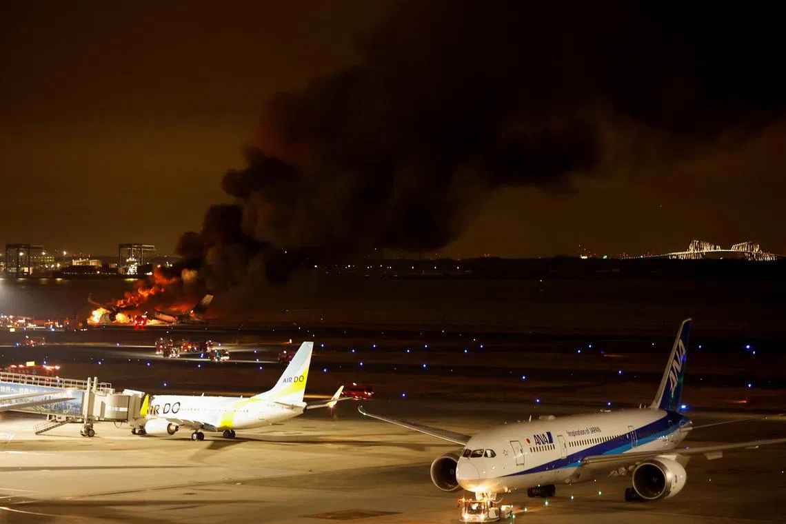 A collision between a Japan Airlines plane and a smaller Coast Guard aircraft caused all runways at Haneda airport to be closed for over three hours on Jan 2.