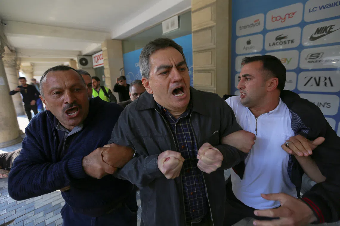 FILE PHOTO: Head of the Popular Front Party of Azerbaijan Ali Karimli and his supporters hold an unauthorized rally to demand the freedom of assembly in Baku, Azerbaijan October 19, 2019. REUTERS/Aziz Karimov/ File Photo
