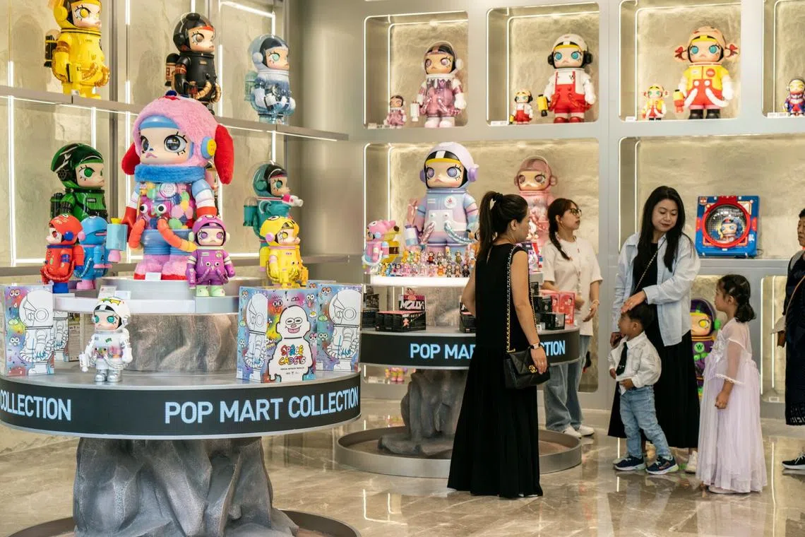 Pop Mart's clientele has shifted from young adults to well-to-do working moms who like to dangle Labubu keychains on their oversized “Big Ass Bag,” a trendy look this year.