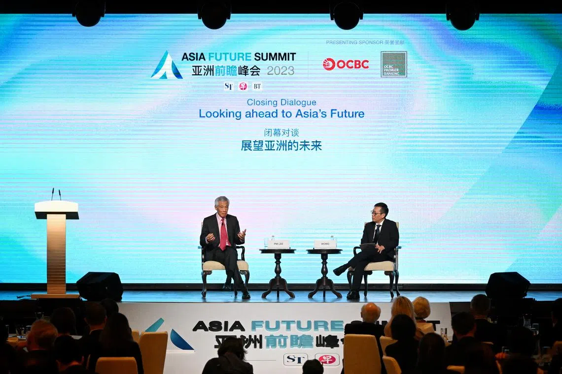 Prime Minister Lee Hsien Loong (left) with Mr Wong Wei Kong, editor-in-chief of SPH Media’s English, Malay and Tamil Media Group, at the Asia Future Summit on Oct 5, 2023.