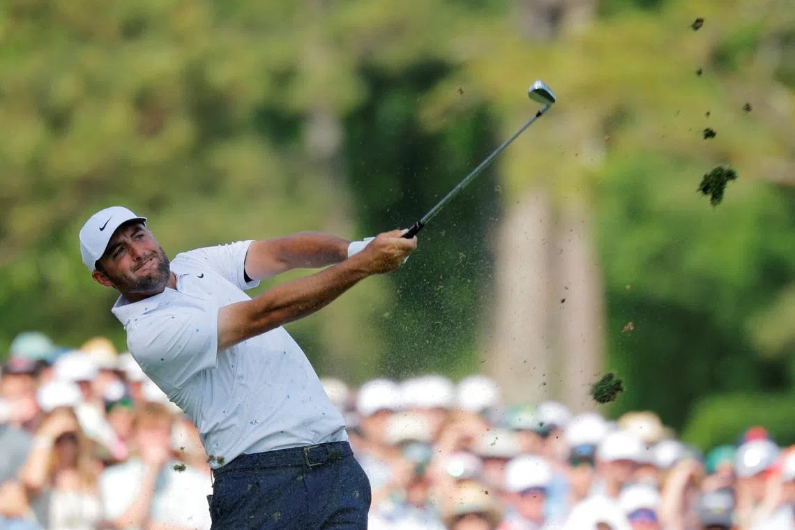 Golf - The Masters - Augusta National Golf Club, Augusta, Georgia, U.S. - April 12, 2026  Scottie Scheffler of the U.S. hits his tee shot on the 12th hole during the final round REUTERS/Mike Blake