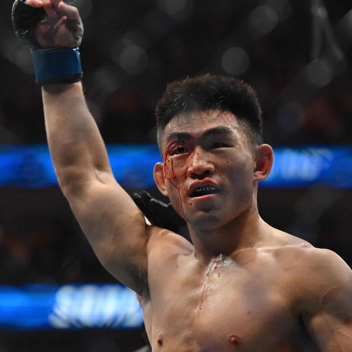 China’s Song Yadong celebrates after beating Russia’s Umar Nurmagomedov in their men’s bantamweight fight during the UFC Fight Night at Oriental Sports Center in Shanghai on Aug 29.