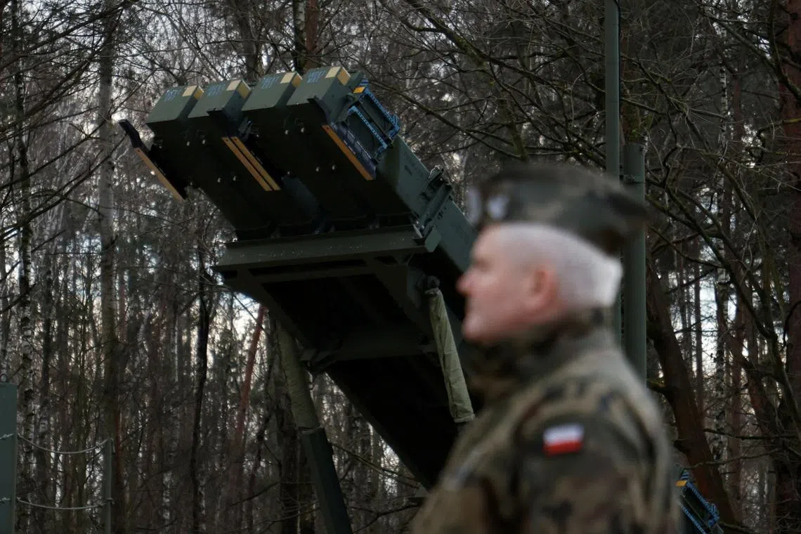 Polish army general stands in front of the surface-to-air missile launcher, the Patriot (Wisla) system, newly added into the Integrated Battle Command System (IBCS) at an army base in Sochaczew, Poland, December 18, 2024. REUTERS/Kuba Stezycki