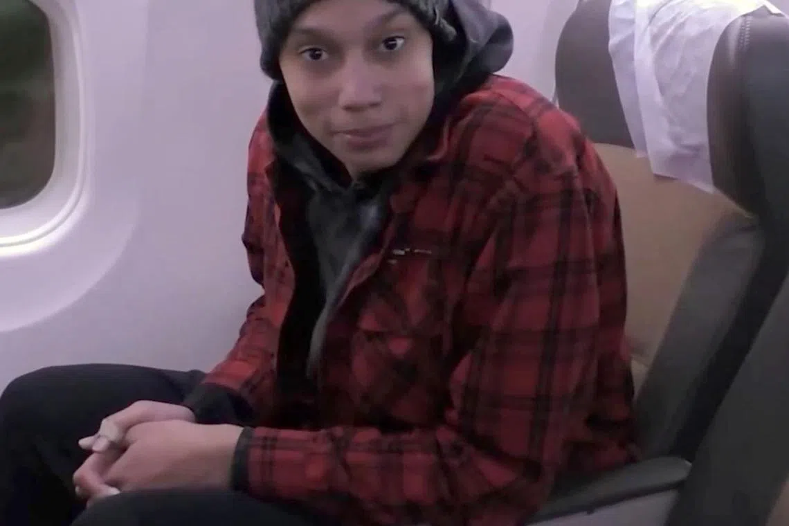 A video grab shows Brittney Griner on a plane headed for the US after her release from a Russian penal colony.