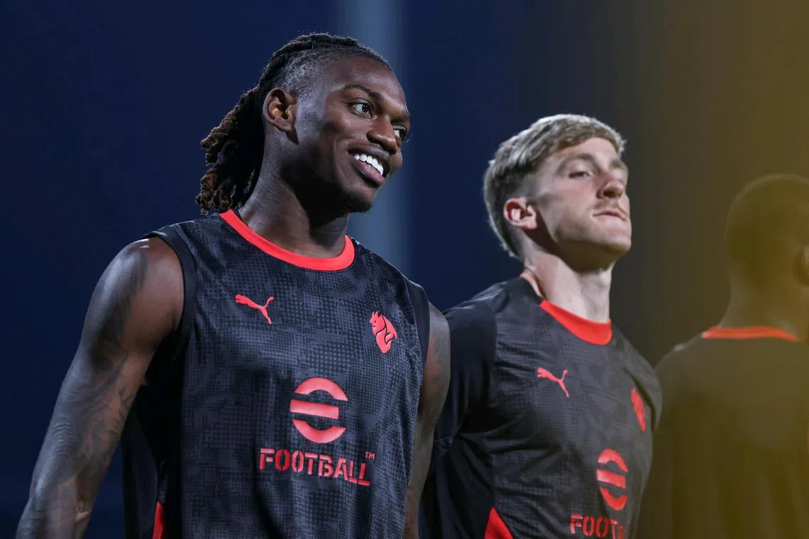 AC Milan forward Rafael Leao alongside his teammate Alexis Saelemaekers during their training session at Bishan Stadium on July 22, 2025. Leao was named Serie A MVP in the 2021-22 season.