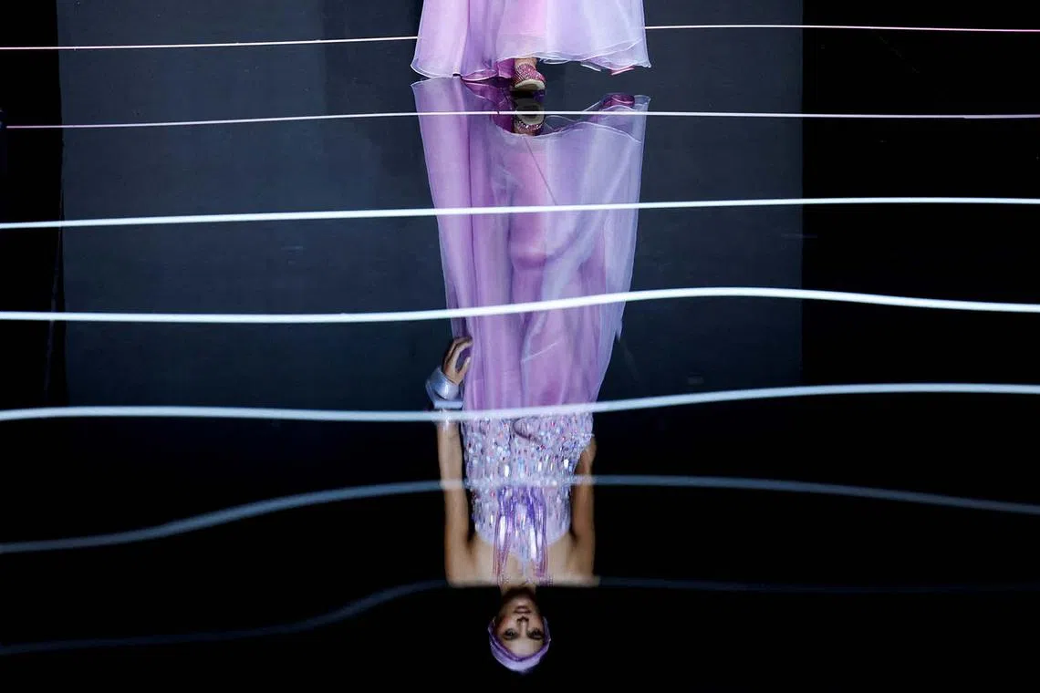 A model presents a creation from the Emporio Armani Spring/Summer 2024 collection during Milan Fashion Week in Milan, Italy, Sept 21.