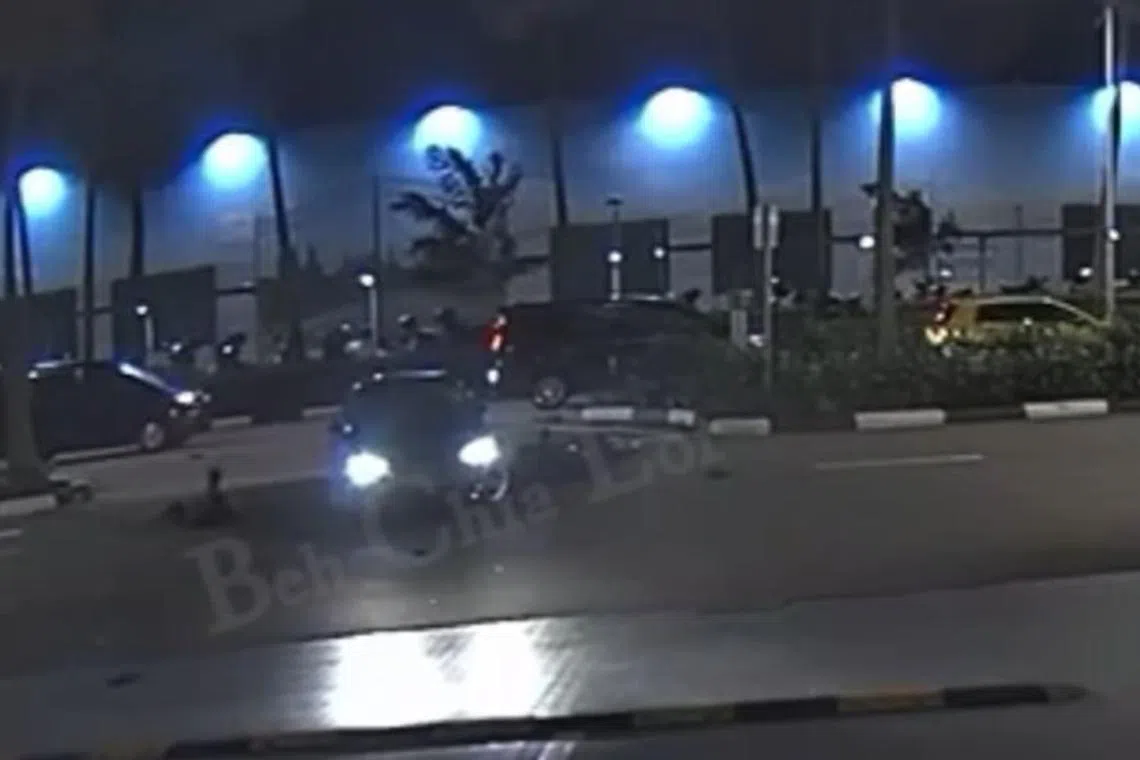 A car was making a right turn when a motorcycle, travelling in the opposite direction of the car, crashed into the side of the car.