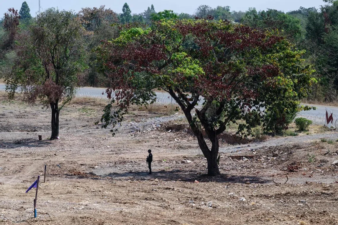 A Thai soldier stands guard during a military organised tour near Klong Paeng, in an area now controlled by the Thai forces following the border conflict with Cambodia on Feb 5.