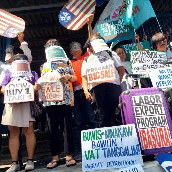 Members of the Migrante International group stage a protest against the Philippines‘ labour export policy in front of the Department of Migrant Workers in Manila during the Iran war, on March 30.