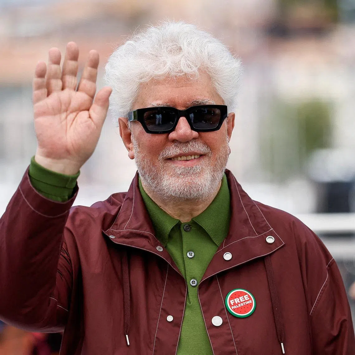 Director Pedro Almodovar who is wearing a \"Free Palestine\" pin,  poses during a photocall for the film \"Amarga Navidad\" (Bitter Christmas - Autofiction) in competition at the 79th Cannes Film Festival in Cannes, France, May 20, 2026. REUTERS/Sarah Meyssonnier