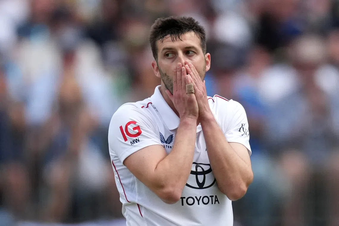 Cricket - The Ashes - Australia v England - First Test - Perth Stadium, Perth, Australia - November 22, 2025 England's Mark Wood looks dejected REUTERS/Asanka Brendon Ratnayake