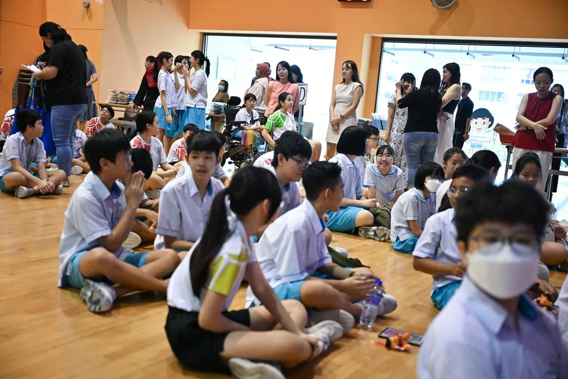 Students wait to collect their PSLE results at Oasis Primary School on Nov 20.