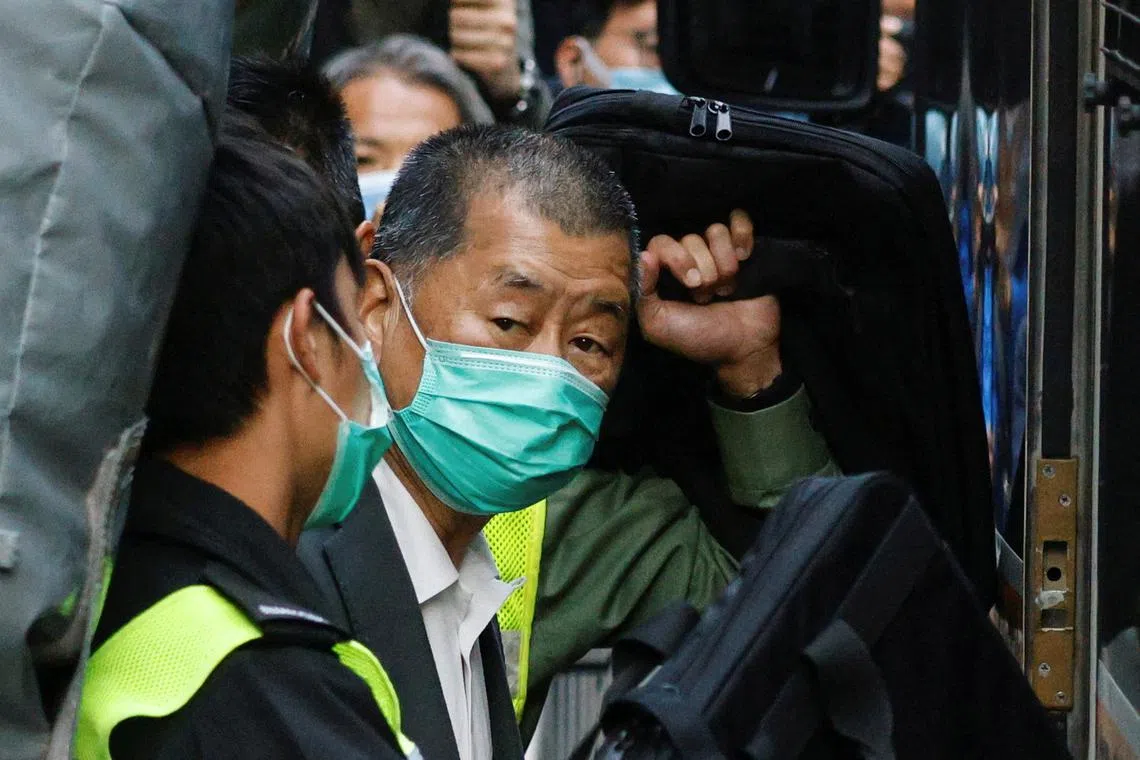 FILE PHOTO: Media tycoon Jimmy Lai, founder of Apple Daily, looks on as he leaves the Court of Final Appeal by prison van, in Hong Kong, China February 1, 2021. REUTERS/Tyrone Siu/File Photo