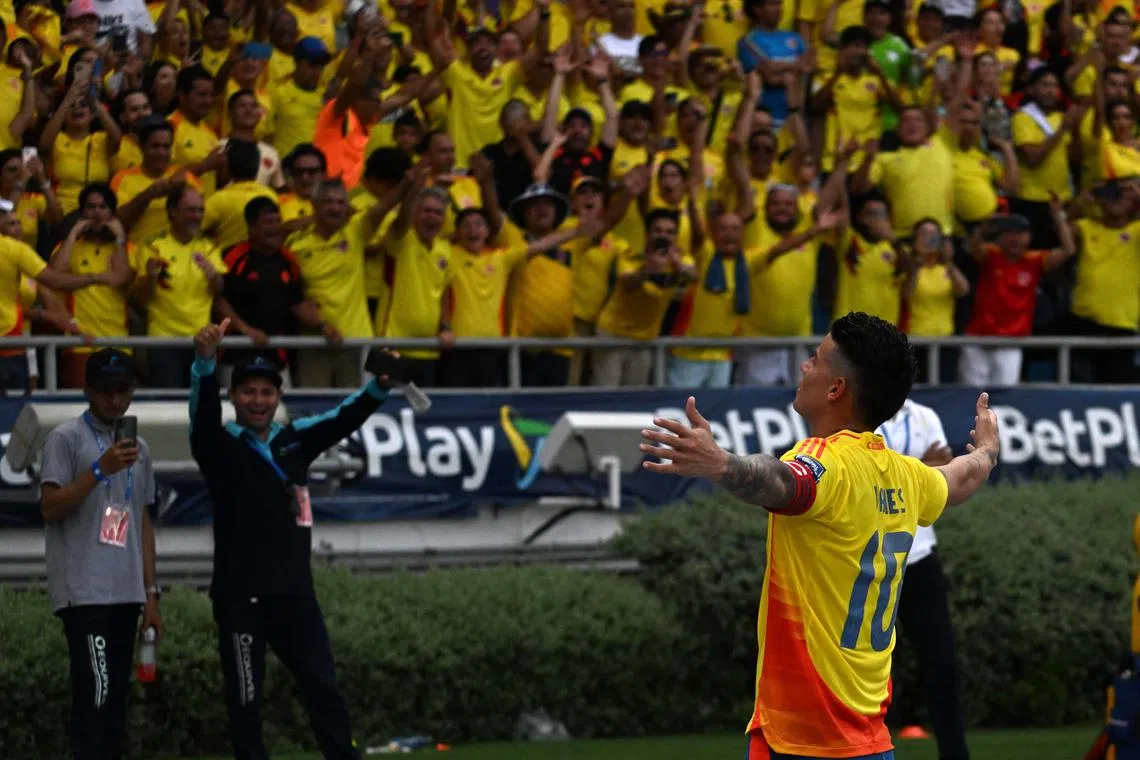 Colombia midfielder James Rodriguez celebrates scoring his team's second goal against Argentina.