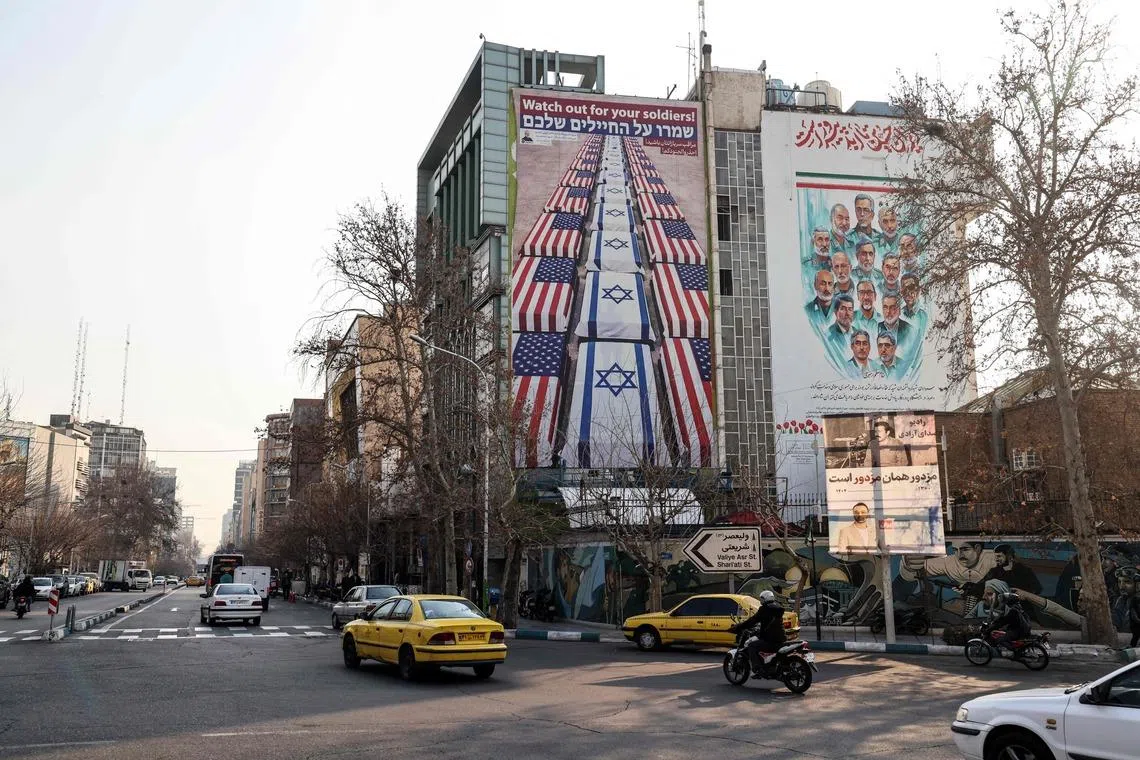An anti-US and anti-Israel banner hanging on a building in Tehran on Jan 27. 