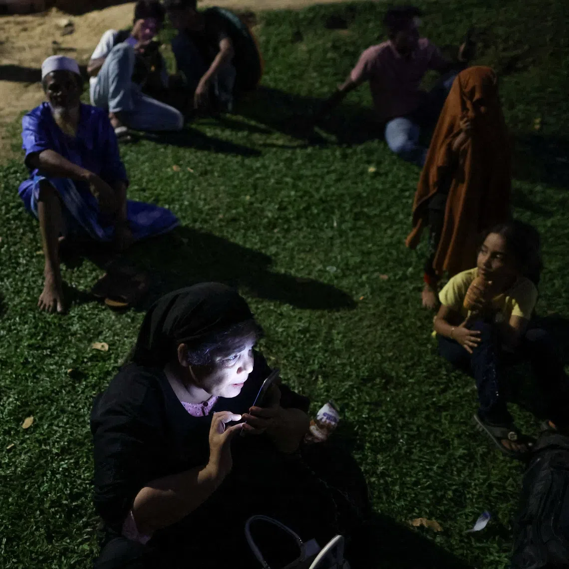 Members of the community gather in front of the office of the UN Refugee Agency after being evicted from their homes, at Kuala Lumpur Malaysia on July 27.