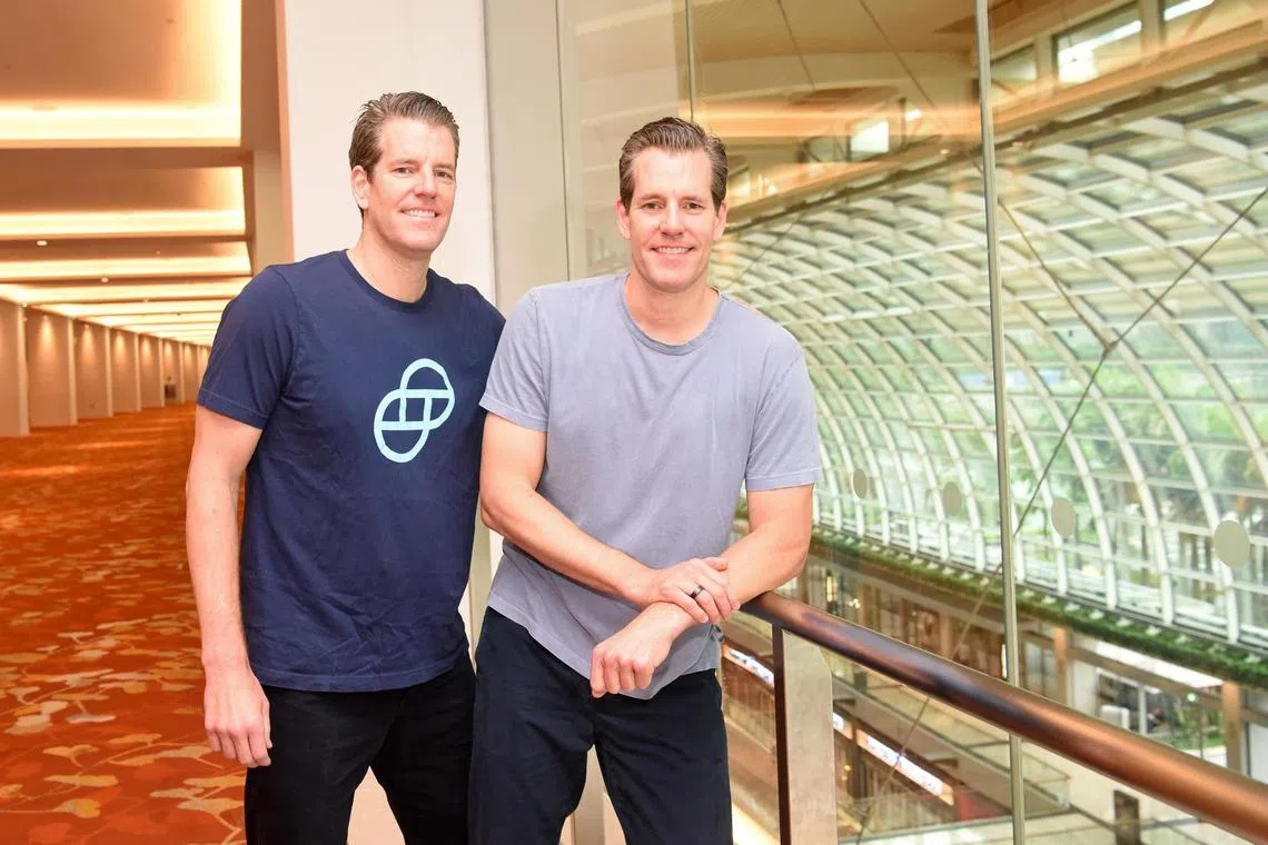 Gemini's co-founders Tyler Winklevoss (from left) and his twin brother Cameron Winklevoss said in Singapore, all 16,554 Gemini Earn accounts will receive their funds worth a notional value of $182 million. 
