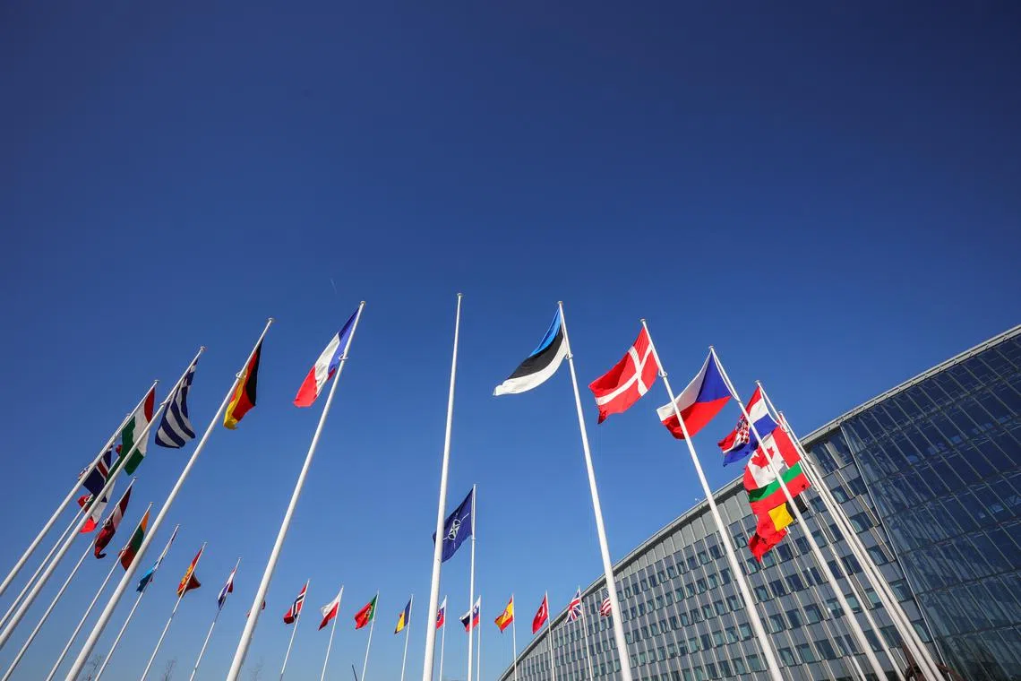 An empty pole stands between flags of Nato members, ahead of Finland’s accession to the organisation, on April 3, 2023.
